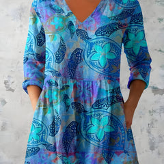 April blue long blouse showing the V-neckline and long sleeves