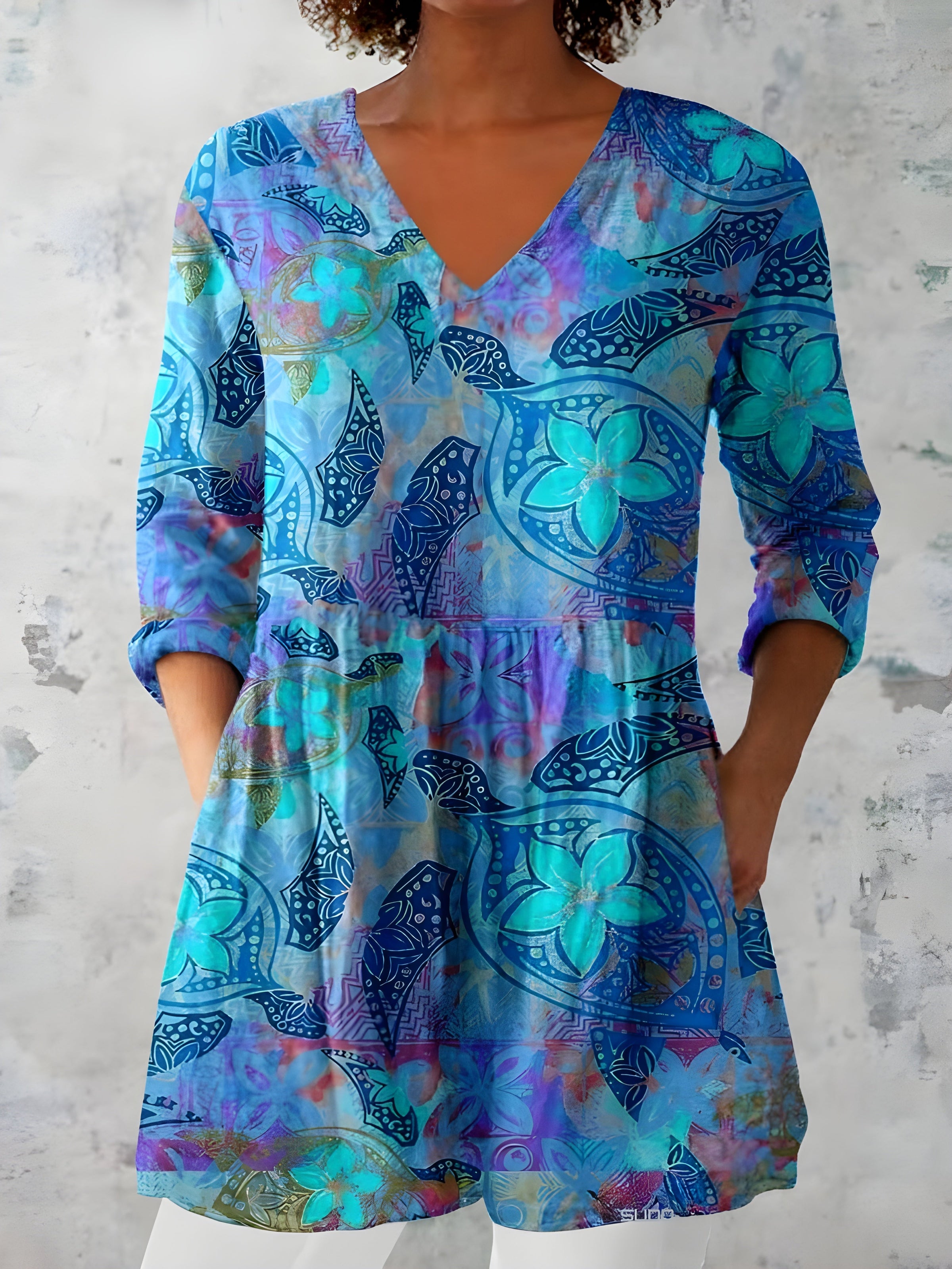 April blue long blouse showing the V-neckline and long sleeves