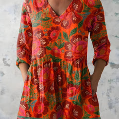 Red orange long blouse with V-neck styled on model