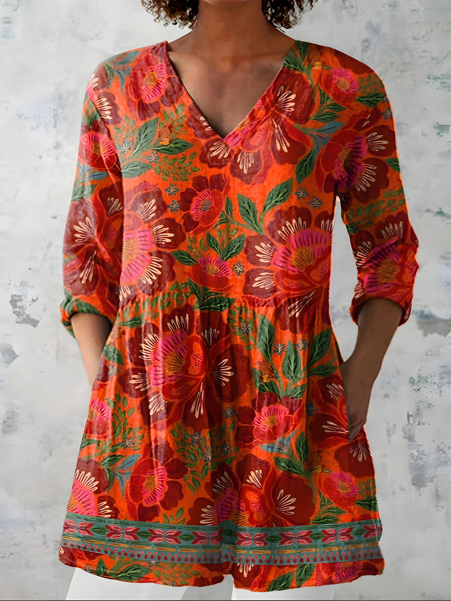 Red orange long blouse with V-neck styled on model