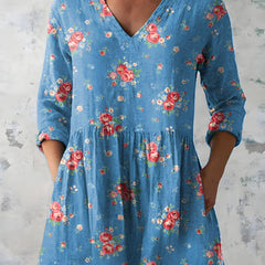 Blue long blouse with V-neck styled on model
