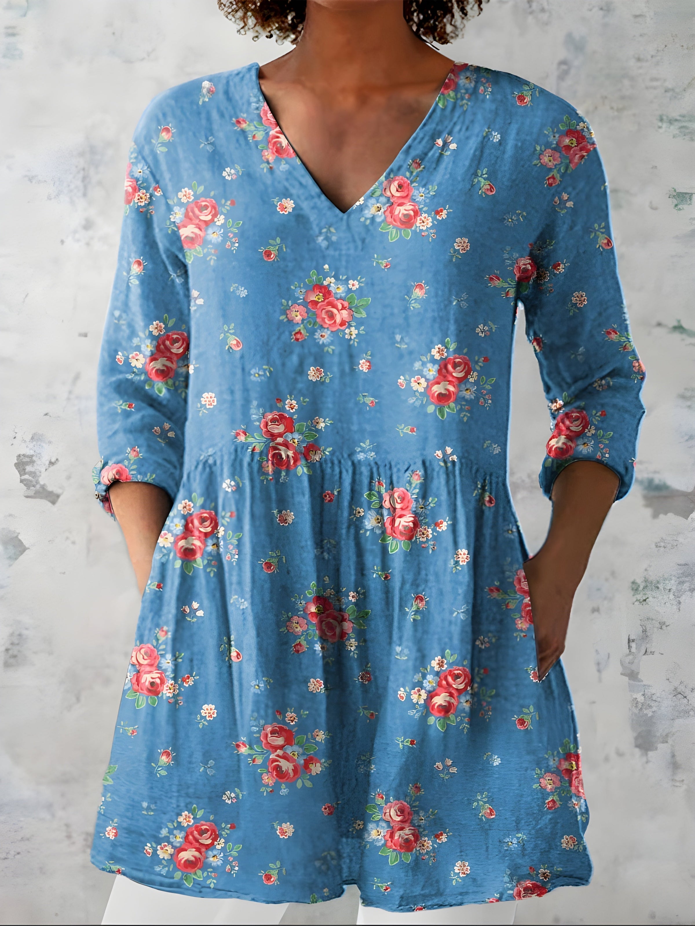 Blue long blouse with V-neck styled on model