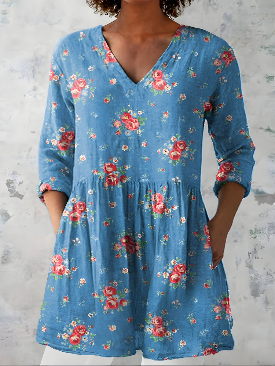 Blue long blouse with V-neck styled on model
