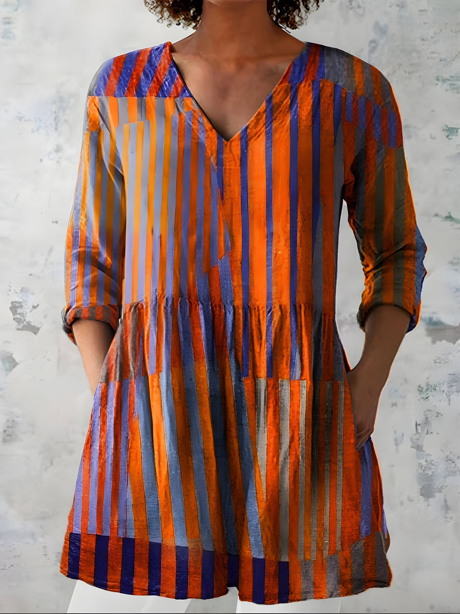 Orange long blouse with V-neck styled on model