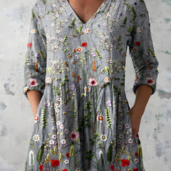 Audrey long blouse styled with a V-neckline
