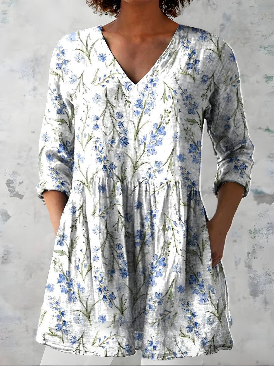 Lenora white long blouse showing the V-neckline