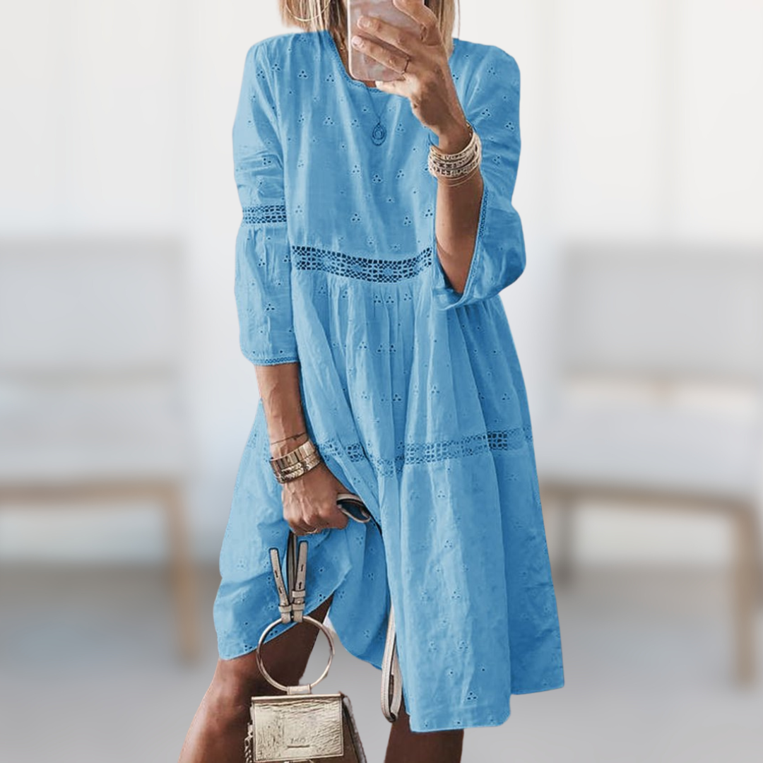 Tiered dress showing crew neck and three quarter sleeves
