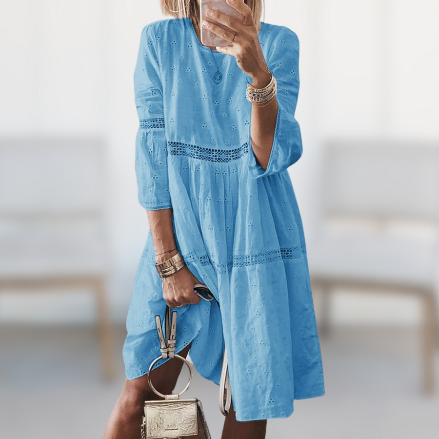 Tiered dress showing crew neck and three quarter sleeves