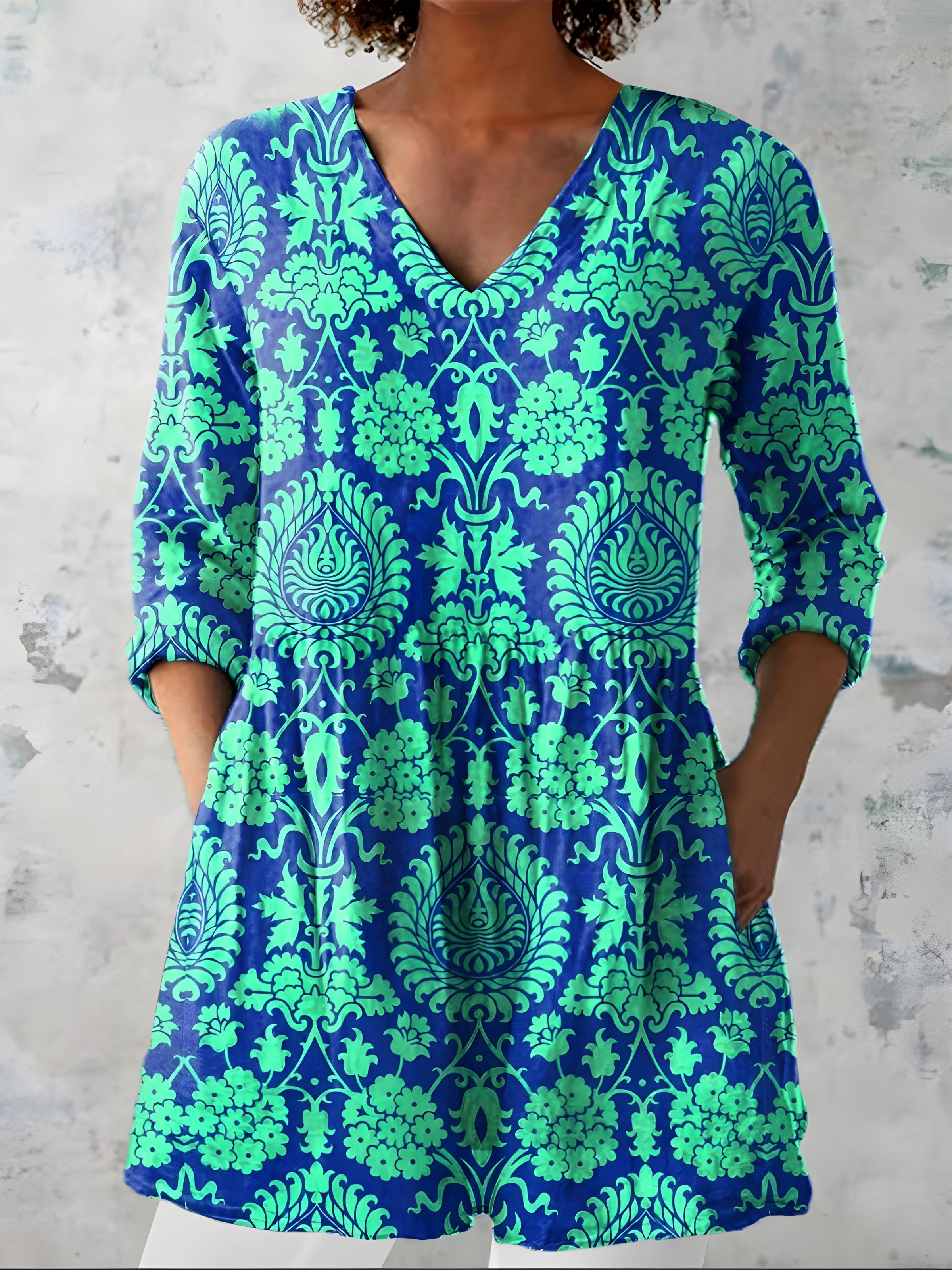 Model wearing the Marlee teal long blouse