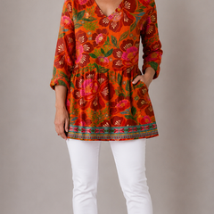 Red orange patterned long blouse with V-neck, front view