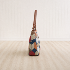 Nella patchwork shoulder bag, side view showing the depth