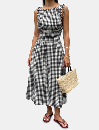Black smocked waist midi dress laid flat