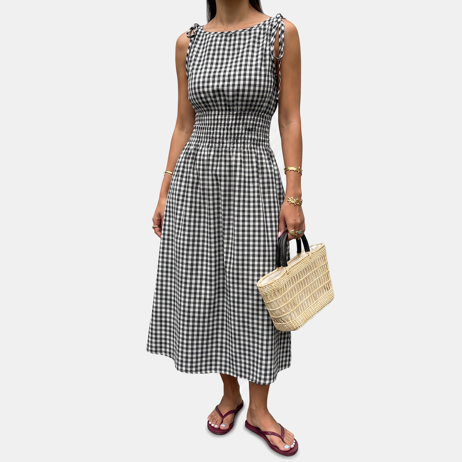 Black smocked waist midi dress laid flat