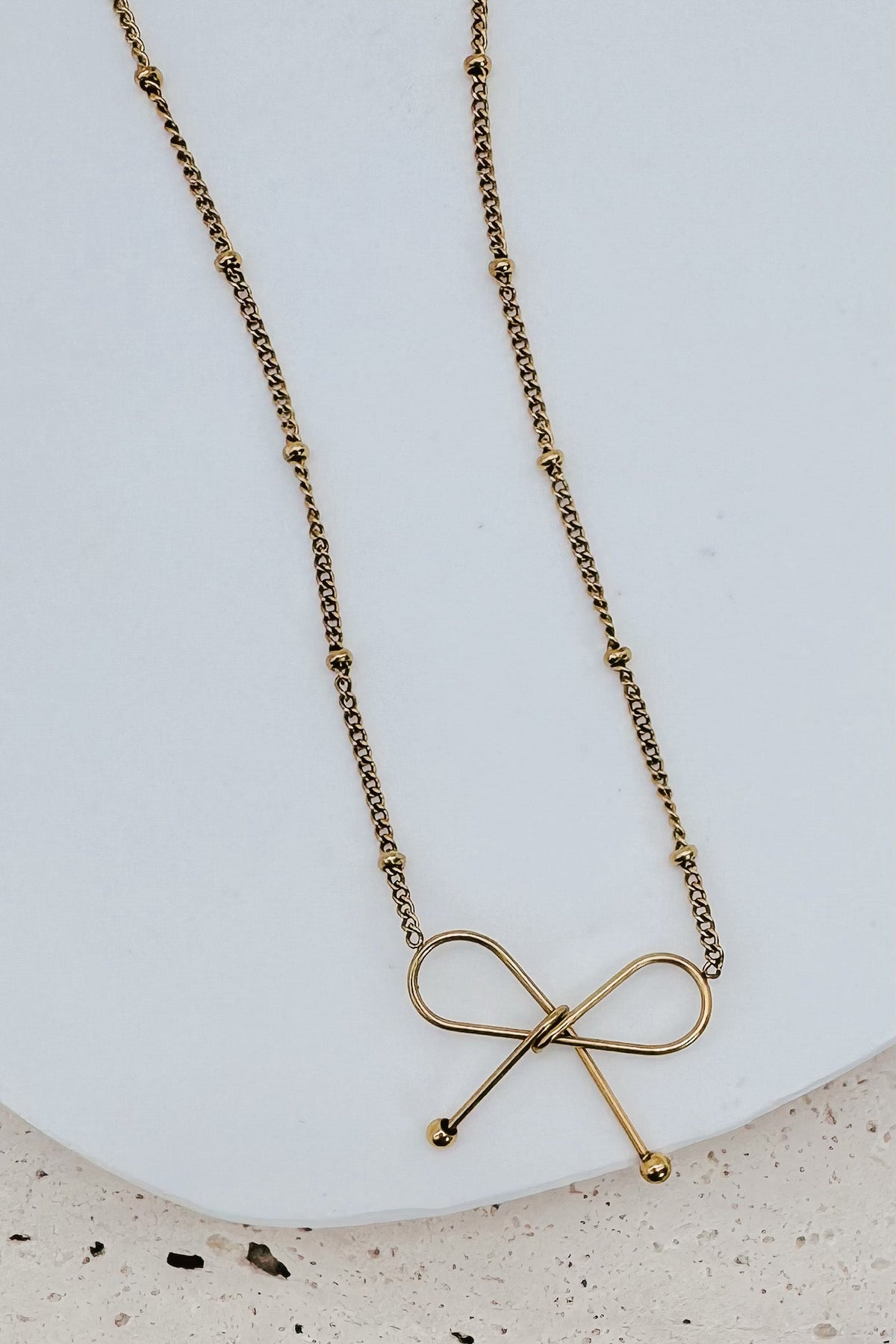 Ivy Dainty Bow Necklace in gold
