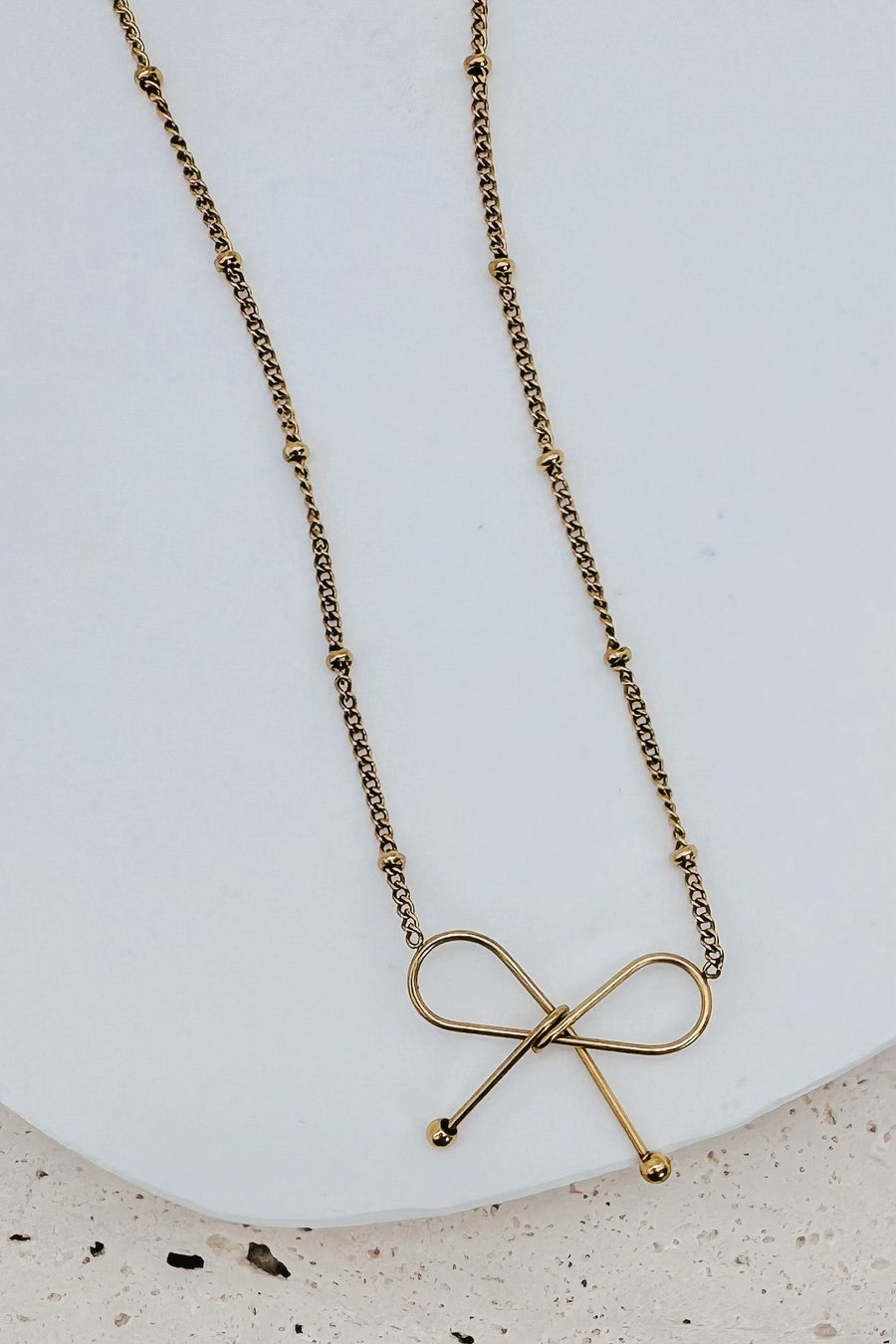 Ivy Dainty Bow Necklace in gold