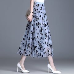 Close view of floral embroidery on the skirt