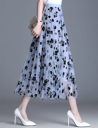 Close view of floral embroidery on the skirt