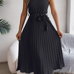 Halter neckline detail on the pleated dress