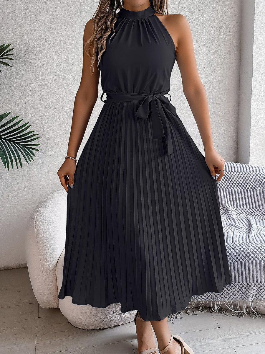 Halter neckline detail on the pleated dress