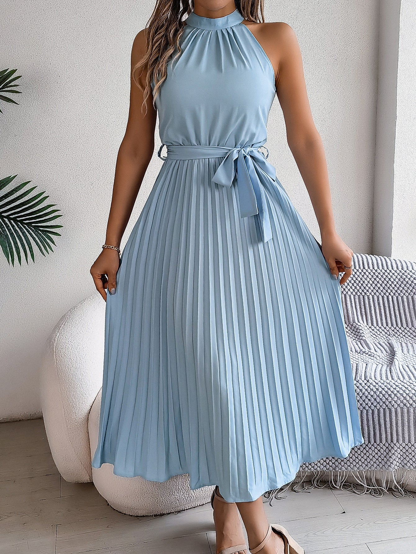 Belted waist and pleated skirt