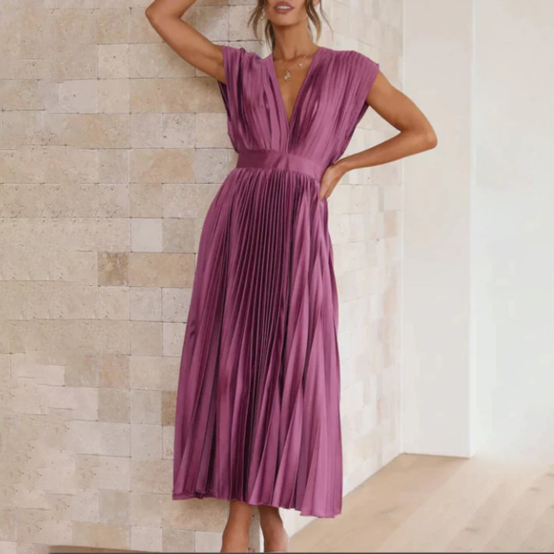 Purple pleated dress showing V neckline