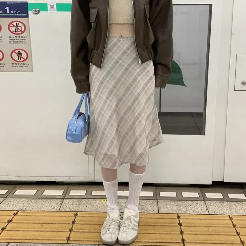 Check midi skirt styled with a knit top