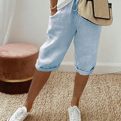 Aleah linen cotton trousers worn with a light top