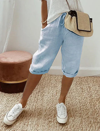 Aleah linen cotton trousers worn with a light top