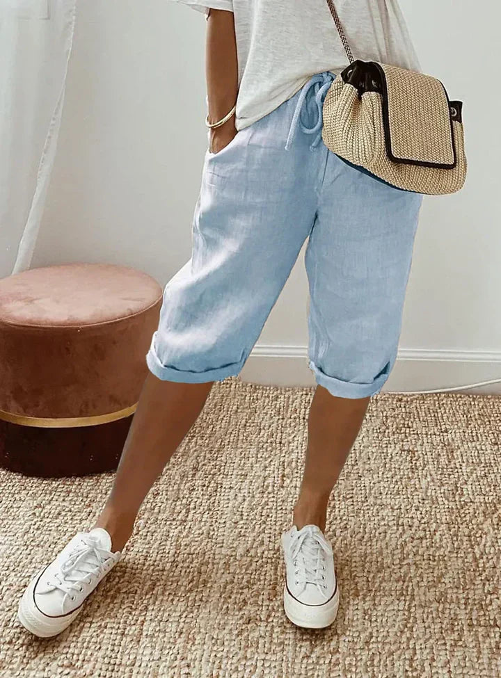 Aleah linen cotton trousers worn with a light top