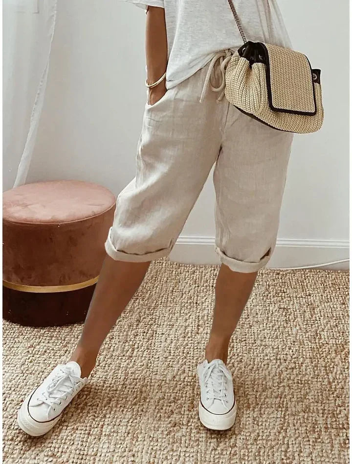 Aleah linen cotton trousers, side view of the relaxed leg