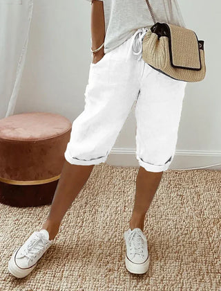 Aleah linen cotton trousers, seated view showing the drape