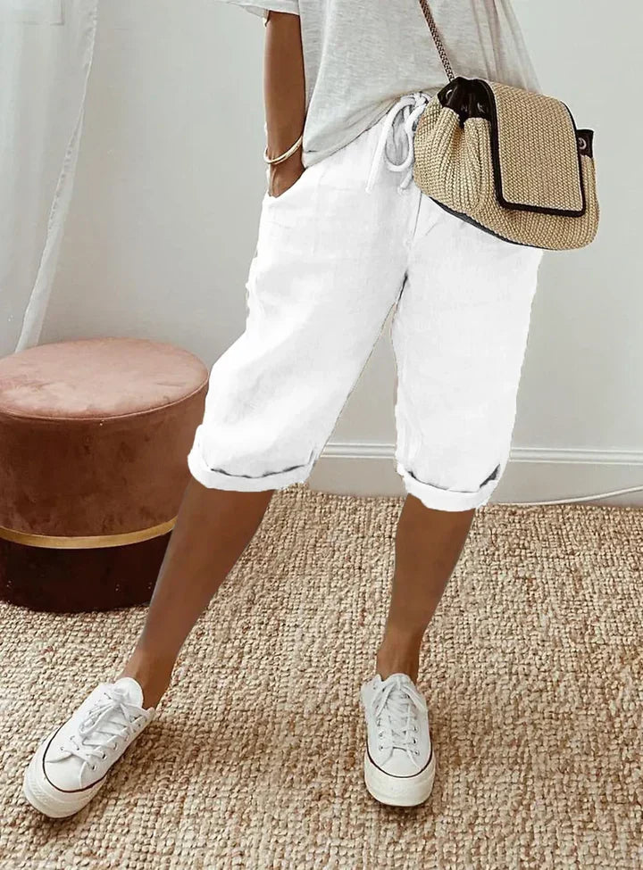 Aleah linen cotton trousers, seated view showing the drape