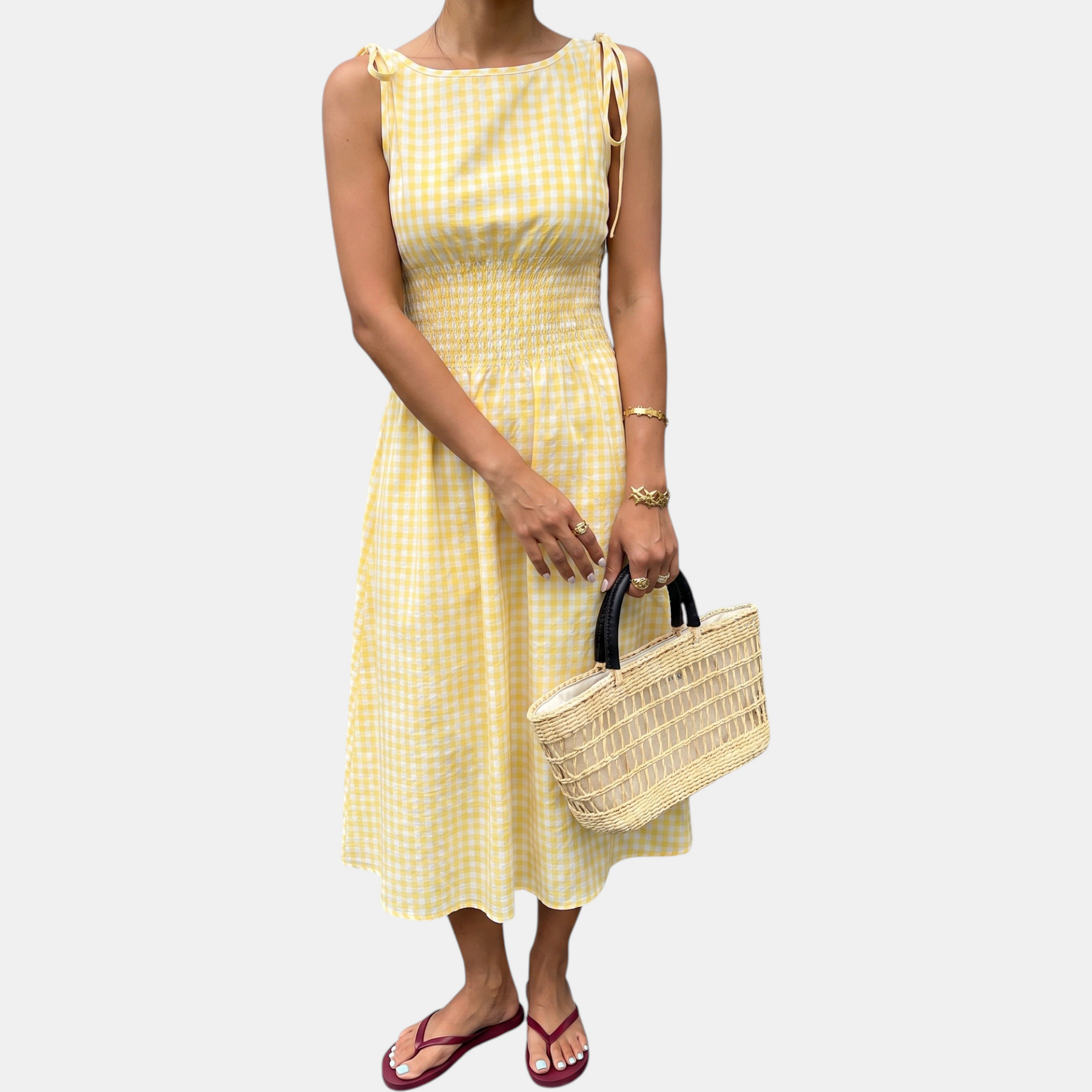 Yellow smocked waist midi dress laid flat