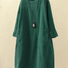 Corduroy midi dress styled with boots